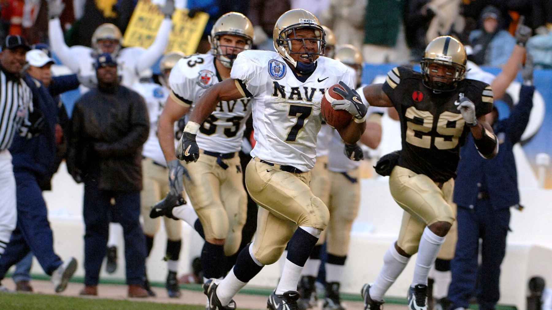 Navy player runs for a touchdown during the Army-Navy college football rivalry game
