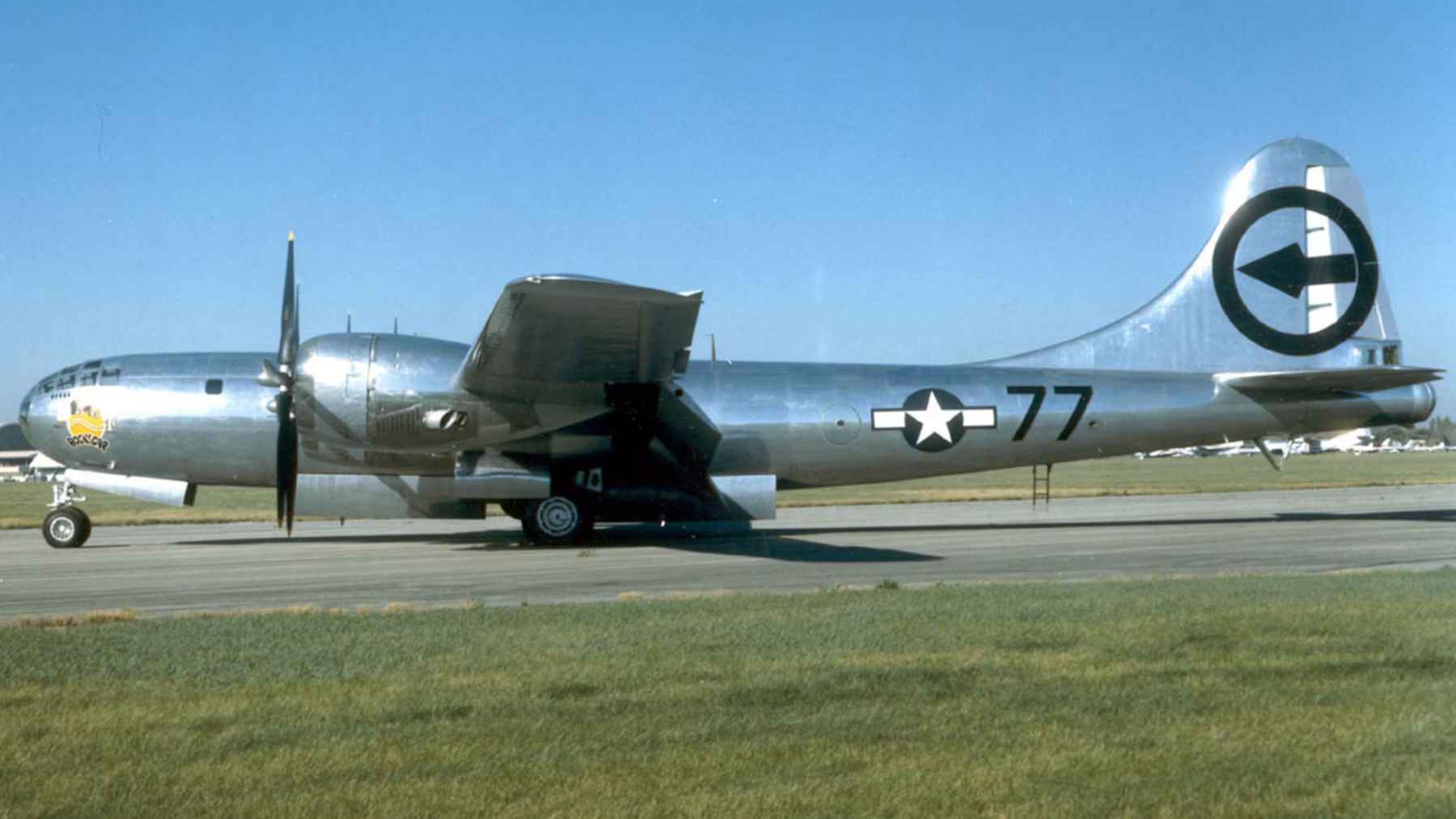 B-29 Superfortress bomber flying midair against a clear sky during an air show
