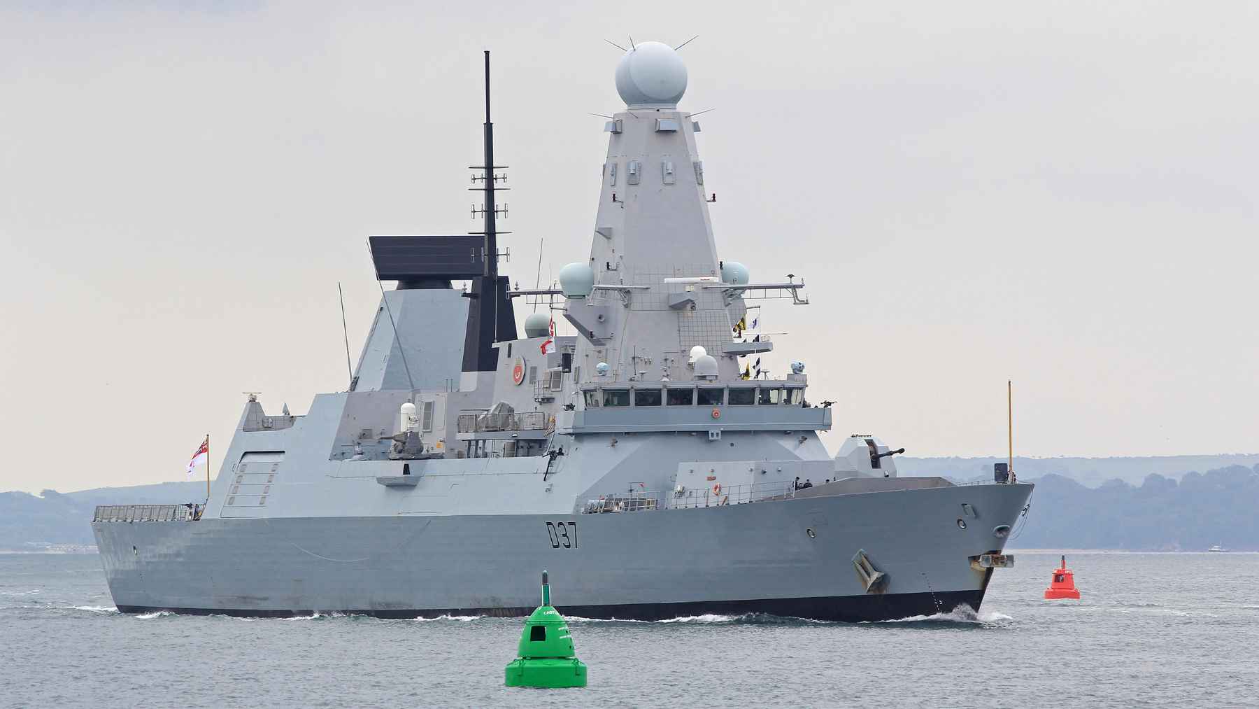 British Royal Navy destroyer HMS Duncan engaging aerial drone targets during a naval defense exercise at sea.