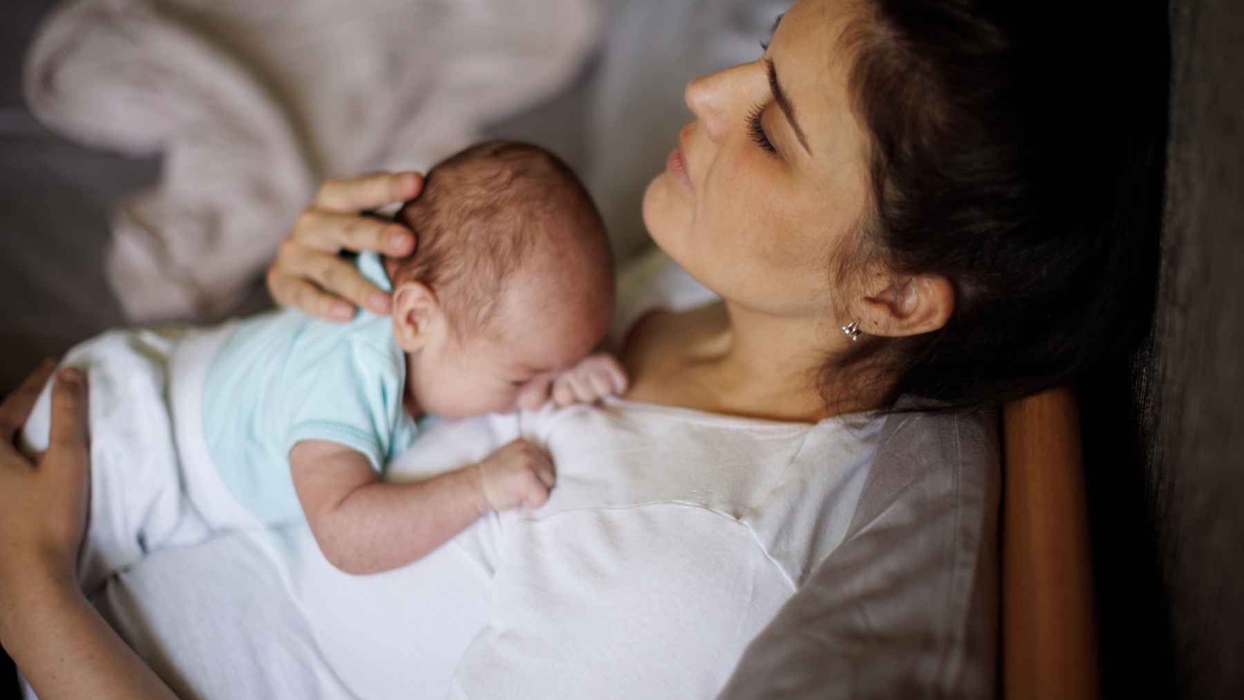 self-employed worker using a laptop at home representing freelance work and lack of access to paid leave benefits