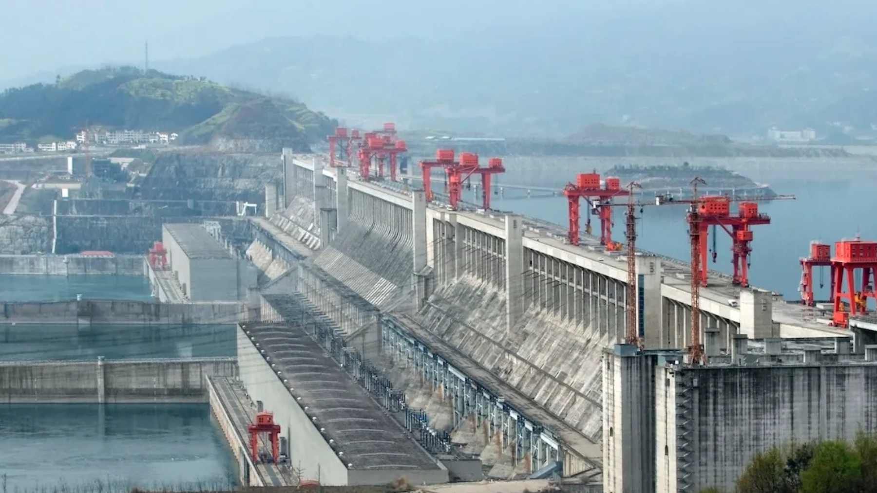 Massive hydropower dam with cranes, reflecting China’s Medog Tibet project planned to triple the Three Gorges Dam’s output.