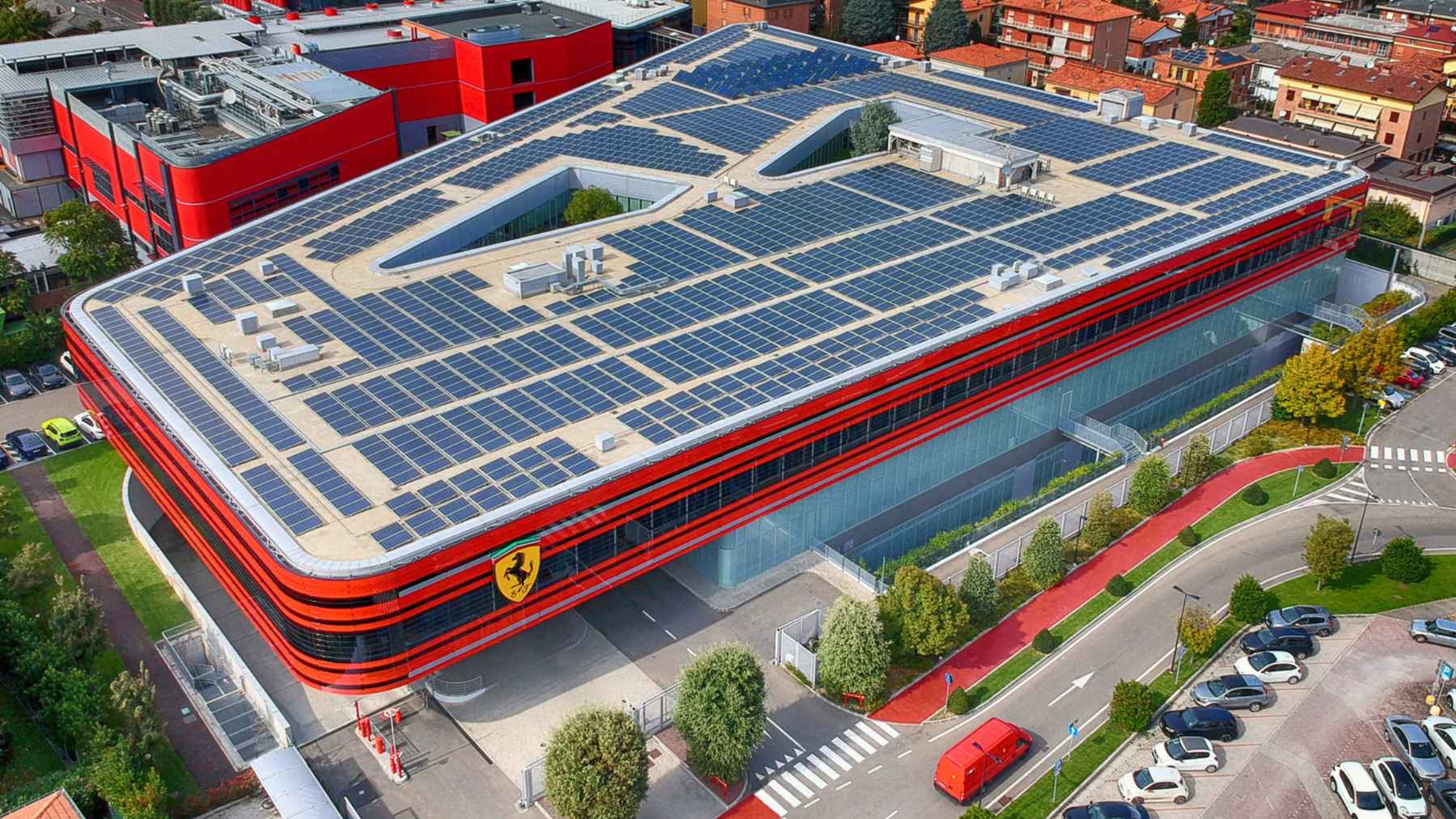 Ferrari facility in Maranello with rooftop solar panels as the luxury automaker invests in electrification and lower-emissions production.