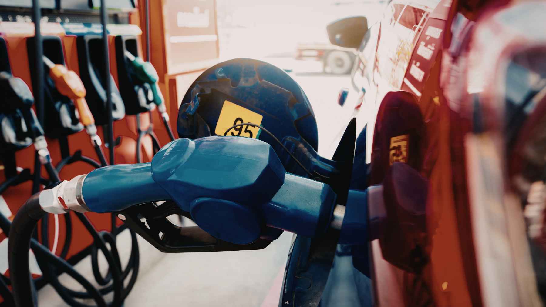 Gas station fuel pump displaying rising gasoline prices impacting household budgets in the United States
