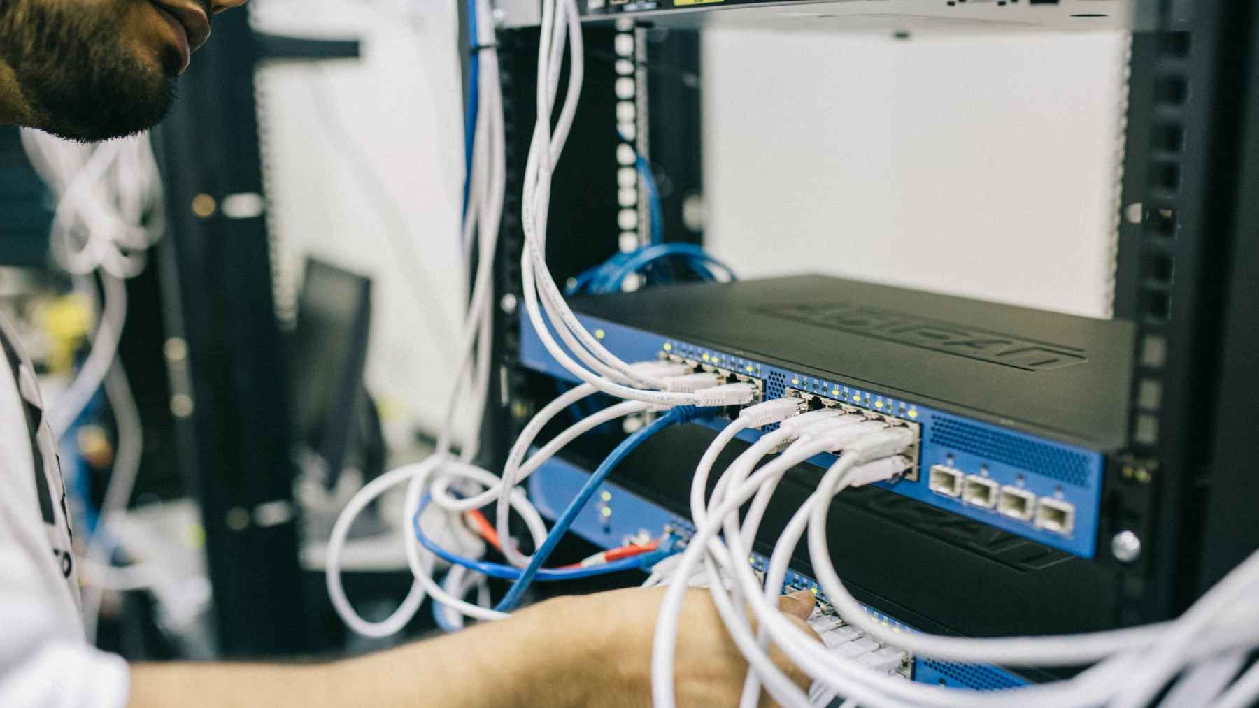 G.hn network adapter connected to a legacy telephone wall jack to deliver gigabit internet over existing copper wiring.