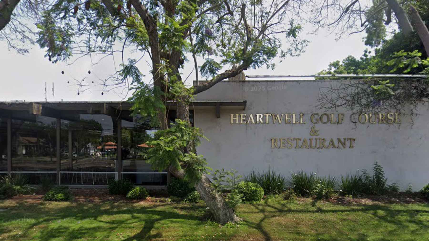 Golf course café area where a lawn mower launched a golf ball, causing a window to shatter and injure a bystander