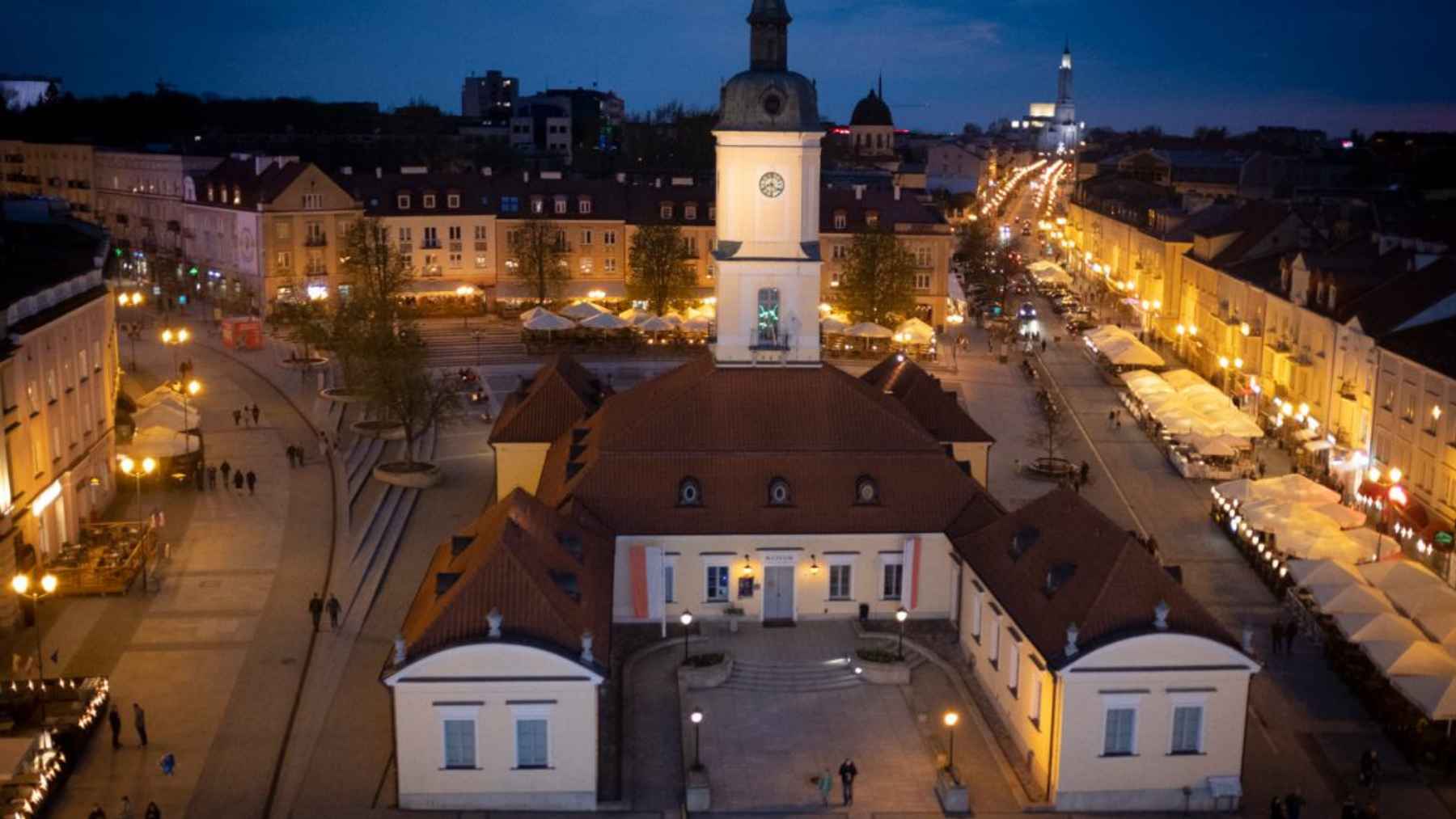Air source heat pump installed outside a residential townhouse used for heating during winter.