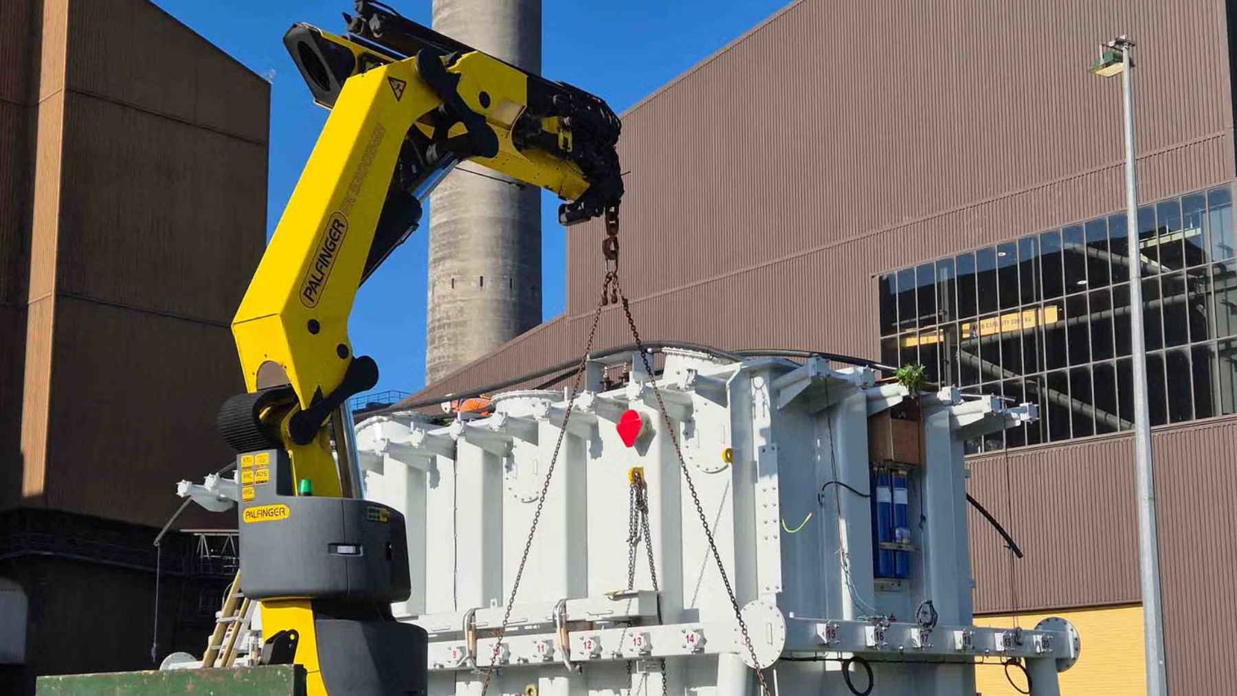 Crane installing massive transformer at Huntly Power Station for grid scale battery energy storage project