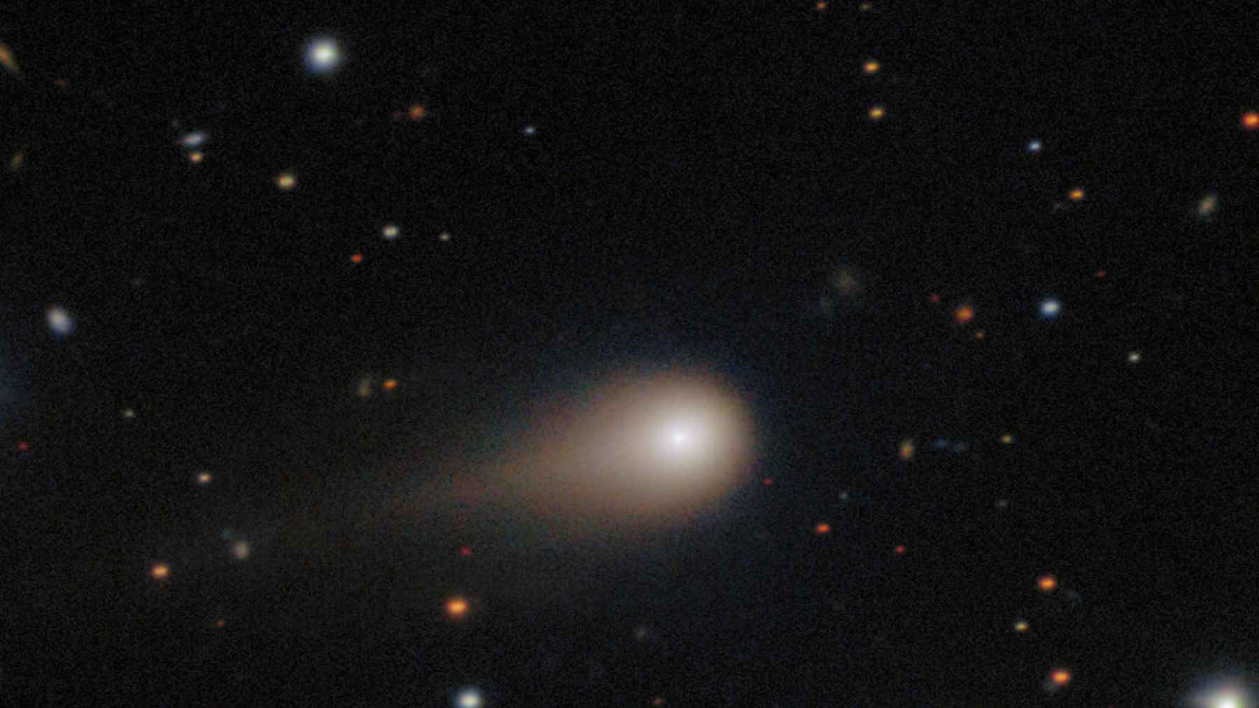 Illustration of interstellar comet 3I ATLAS traveling through the solar system on a hyperbolic trajectory.