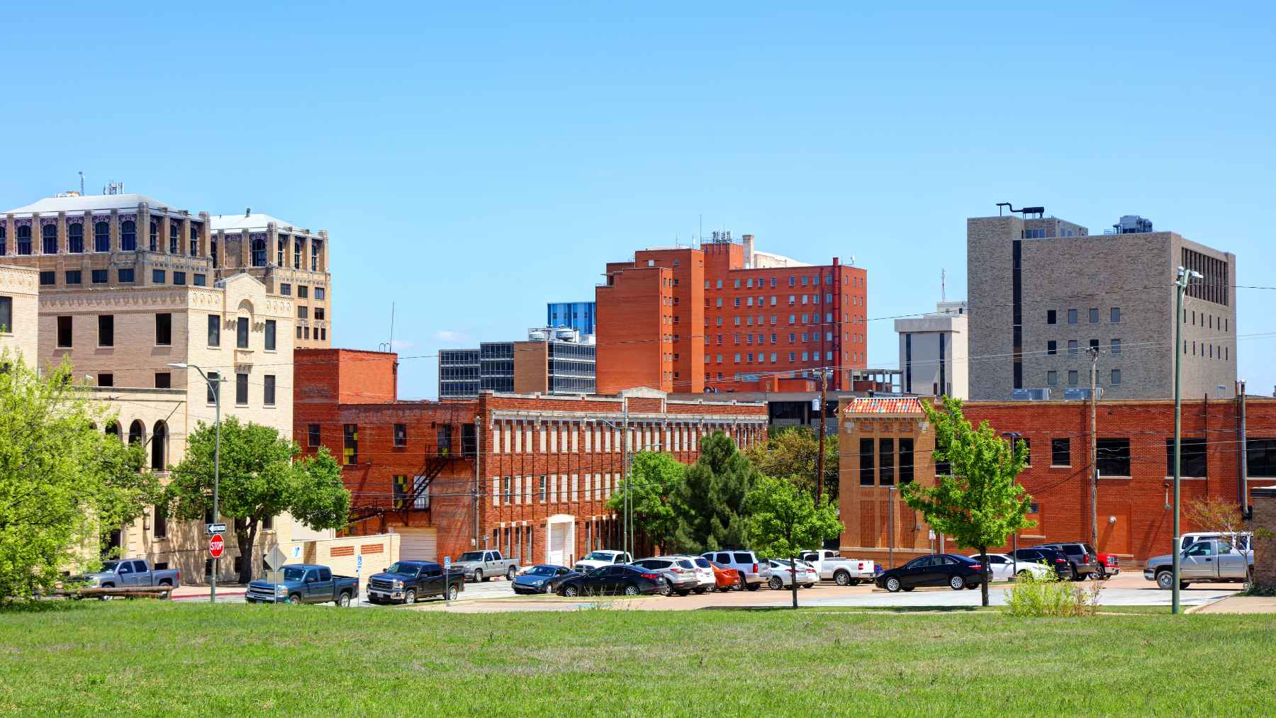 Wichita, Kansas neighborhood and city buildings as lawmakers debate rent flexibility and cleaner housing solutions.