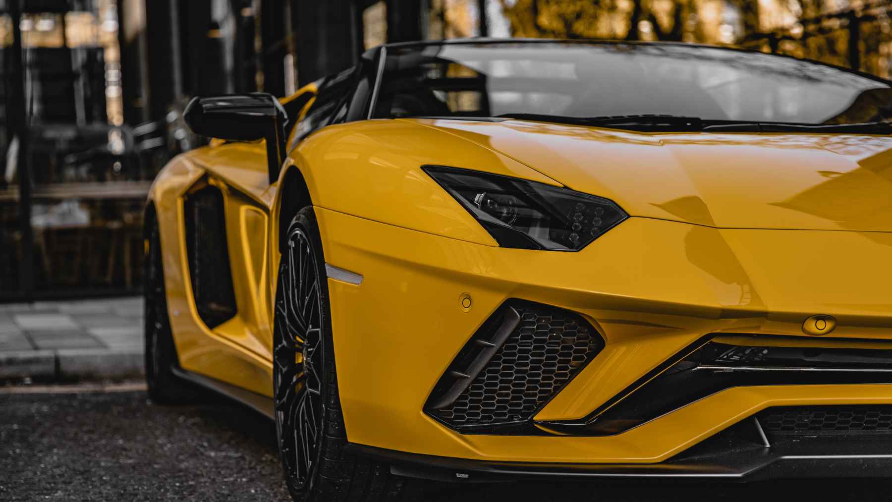 Yellow Lamborghini sports car parked outdoors, illustrating the 2026 cars recognized by women automotive journalists worldwide