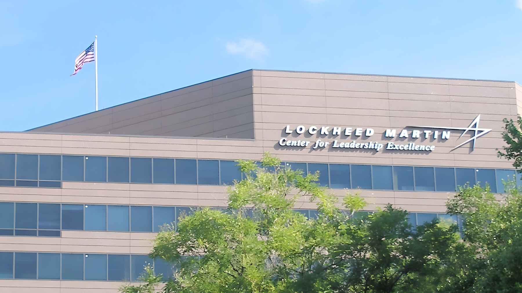 Lockheed Martin office building exterior with company logo and American flag in front