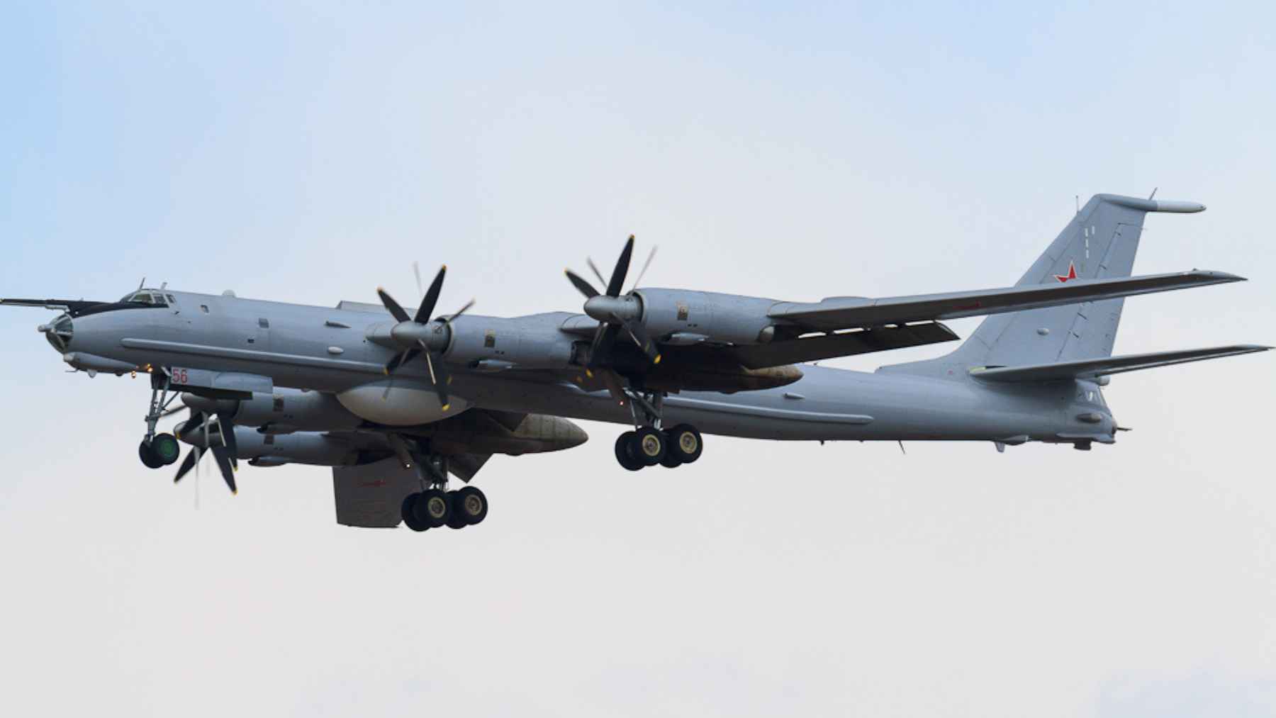 Russian Tu-95 strategic bomber aircraft flying during a long-range patrol mission near the Arctic region