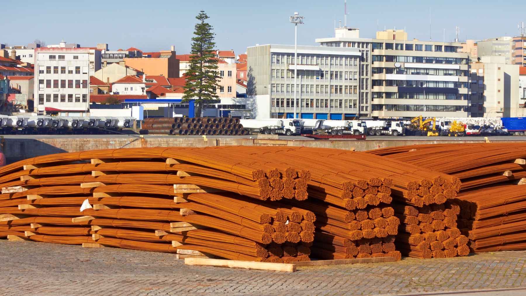 Rusty reinforcing steel bars on a construction site showing surface rust that engineers must evaluate before concrete placement.