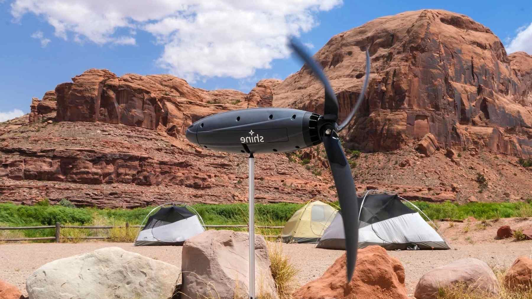 Shine 2.0 portable wind turbine charging at a campsite, pitched as a camping alternative to solar energy