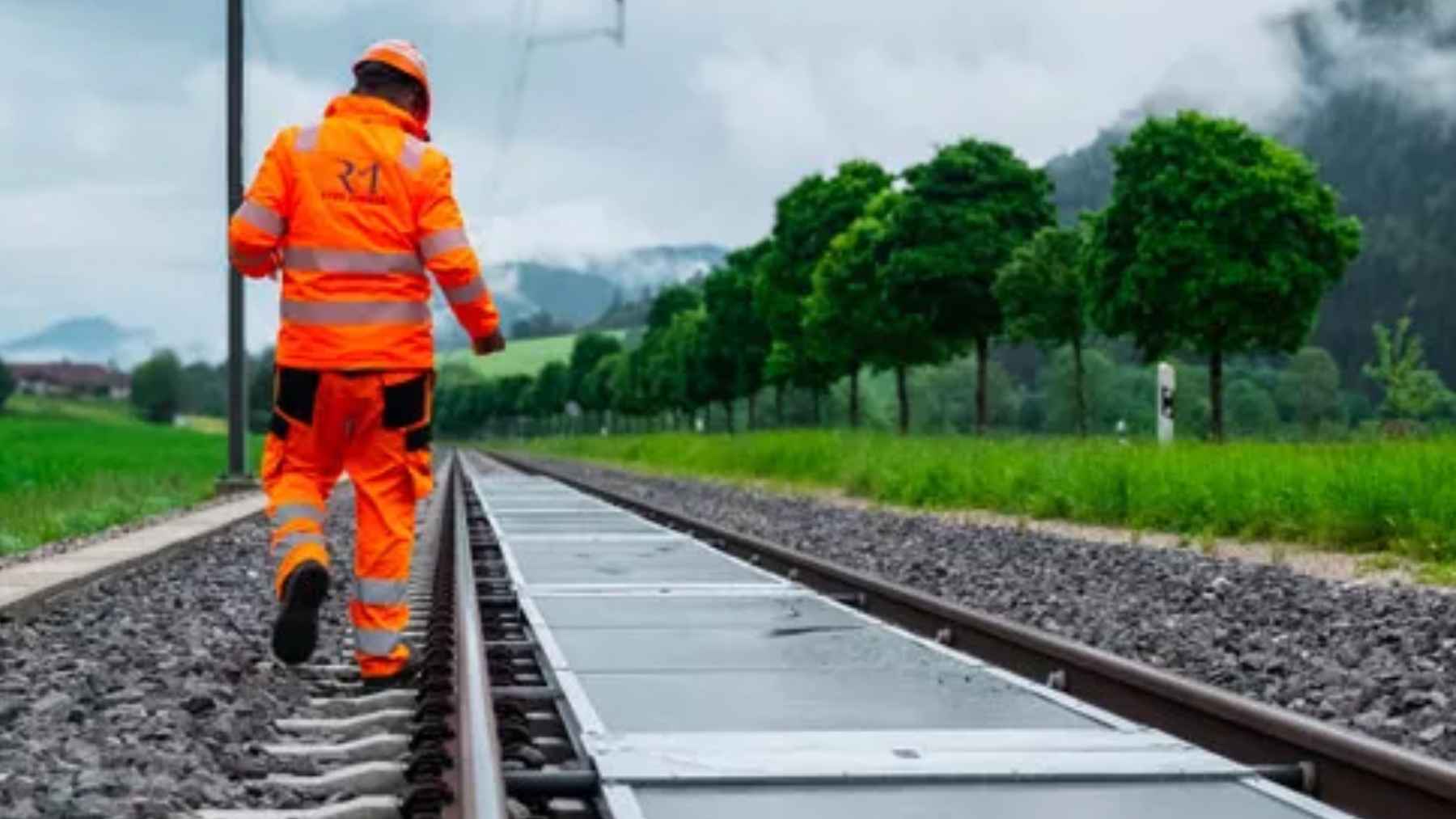 Removable solar panels installed between active train tracks in Buttes, Switzerland, as part of a Sun-Ways pilot project