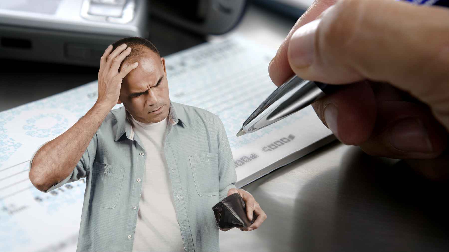 Man holding an empty wallet in front of a large check after thieves altered and cashed a $28,000 payment.