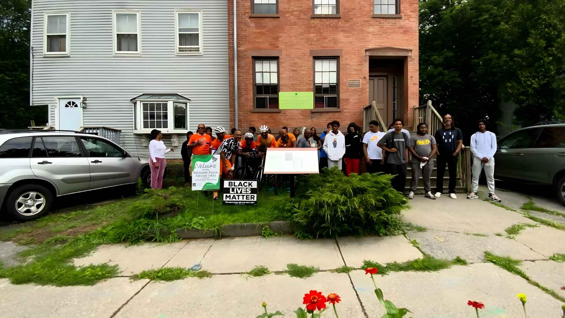 Group gathered outside the Underground Railroad Education Center in Albany, the museum now challenging the cancellation of a federal grant