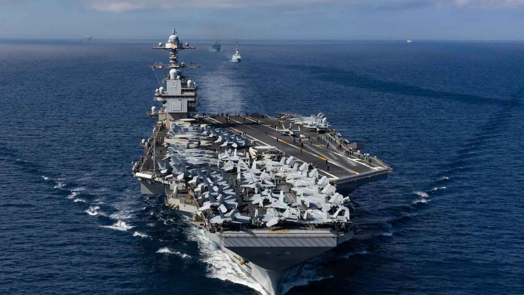 USS Gerald R. Ford aircraft carrier sailing with its strike group during a long overseas deployment.