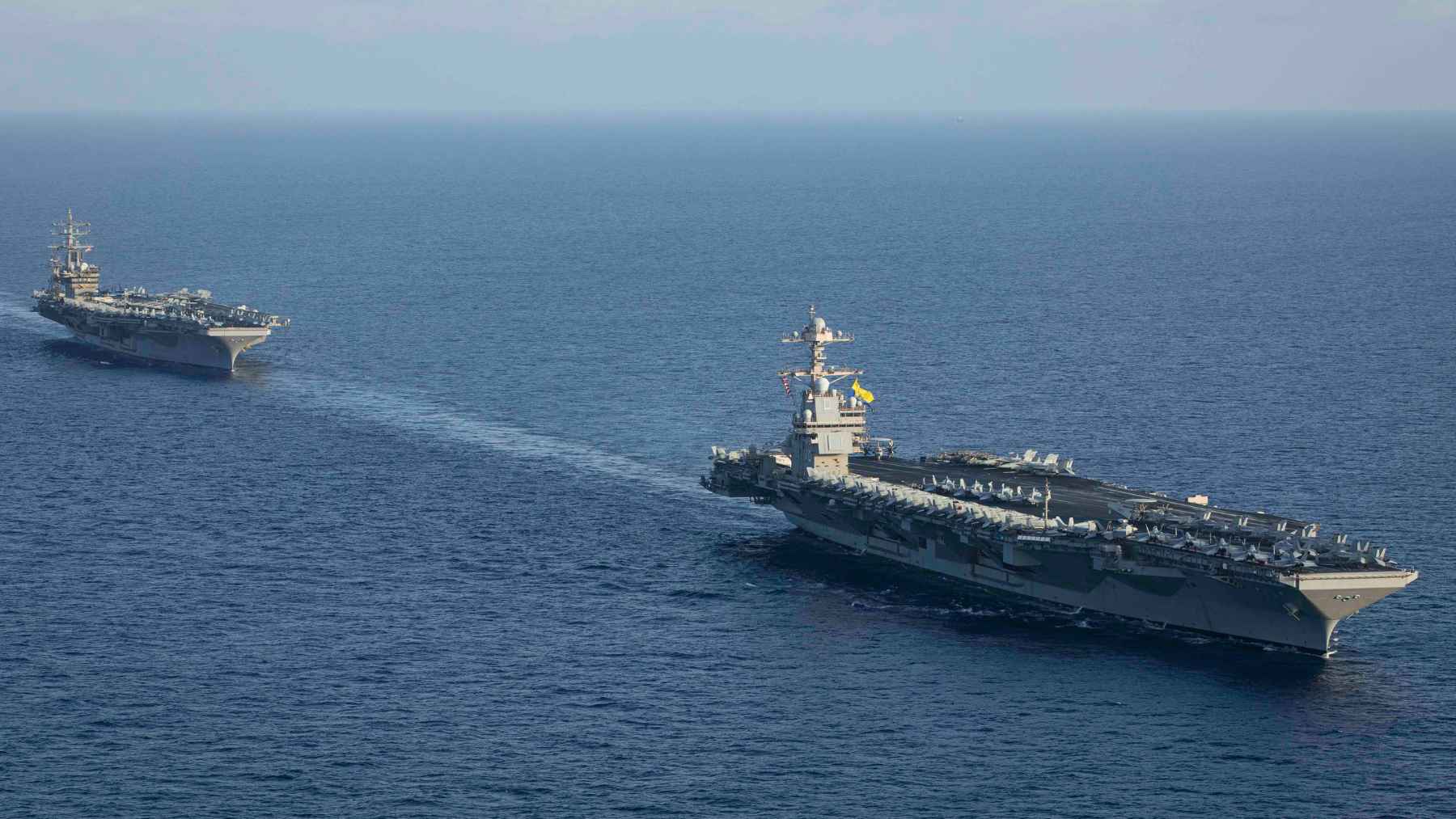 USS Gerald R. Ford aircraft carrier sailing near the Strait of Gibraltar during an extended U.S. Navy deployment.