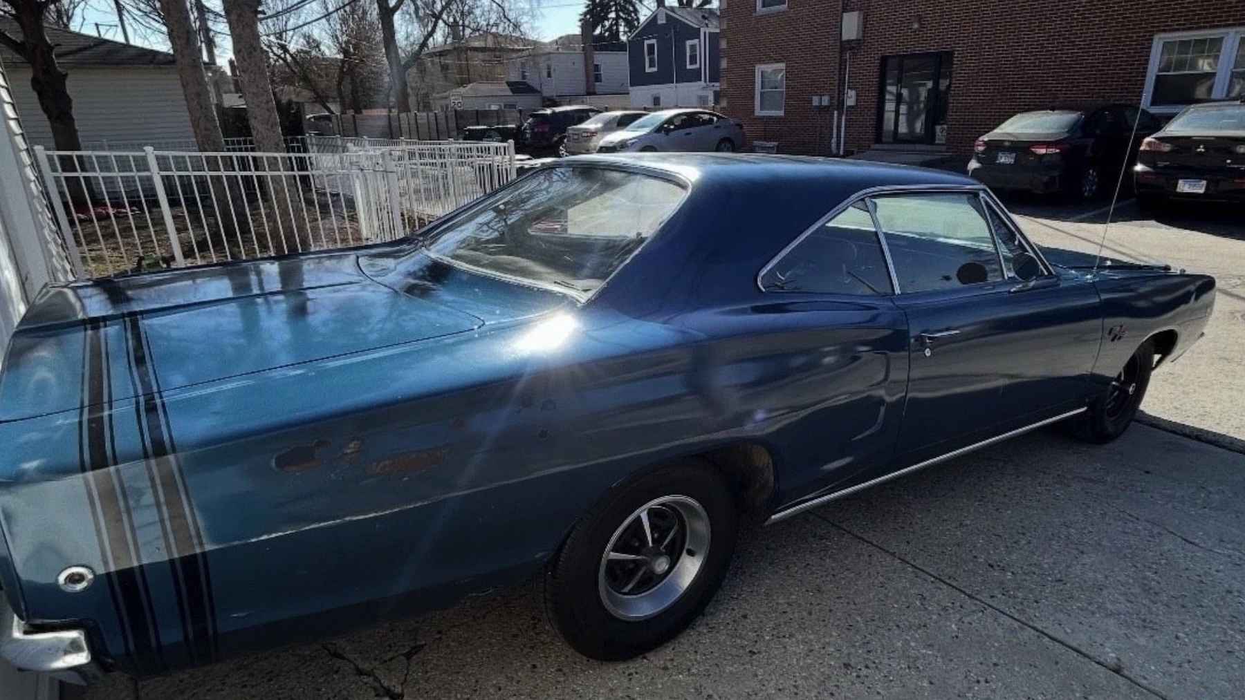 Goodbye to a family muscle car: this 1968 Dodge is going up for sale because the memories inside it turned out to be too much 1 Blue 1968 Dodge Coronet R/T parked in a residential driveway under sunlight