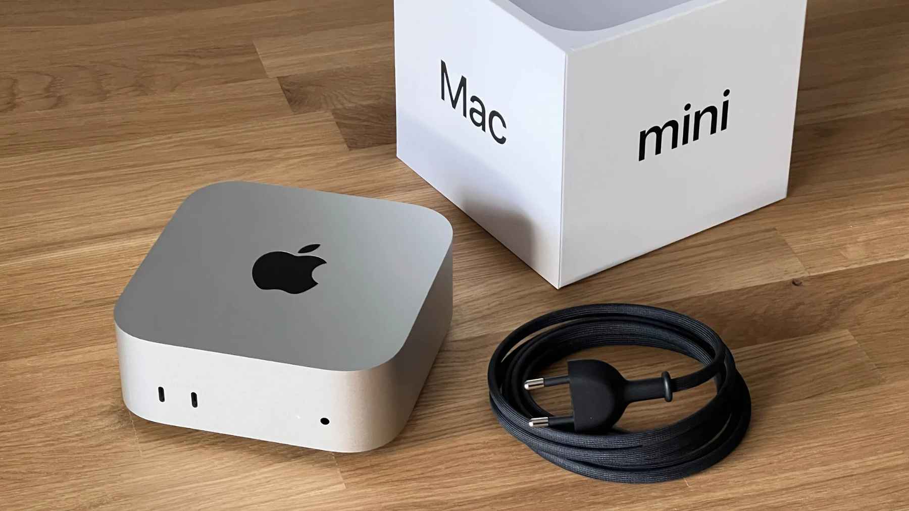 Apple Mac mini connected to an external GPU enclosure for AI acceleration using Thunderbolt or USB4