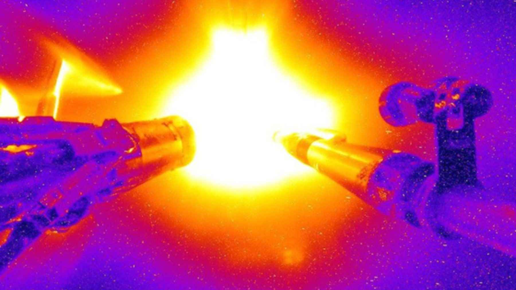 A humanoid robot prototype standing in a neutral pose against a plain background, highlighting modern robotics design