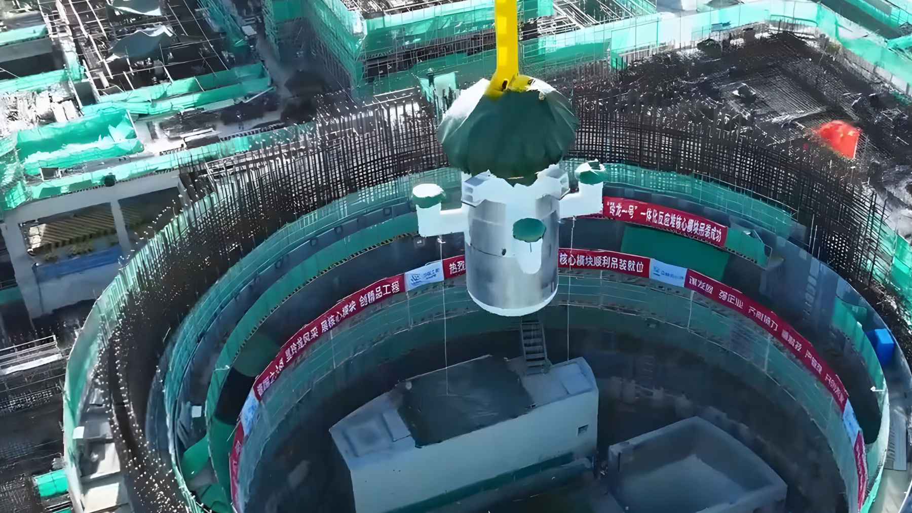Installation of a nuclear reactor pressure vessel at a construction site in China