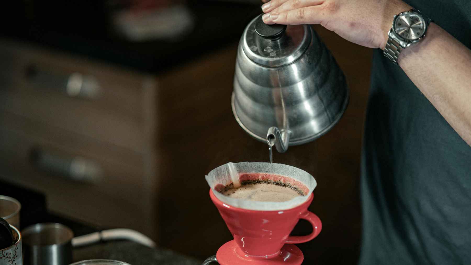 Used coffee grounds being processed into biobutanol as part of clean fuel research and waste to energy innovation