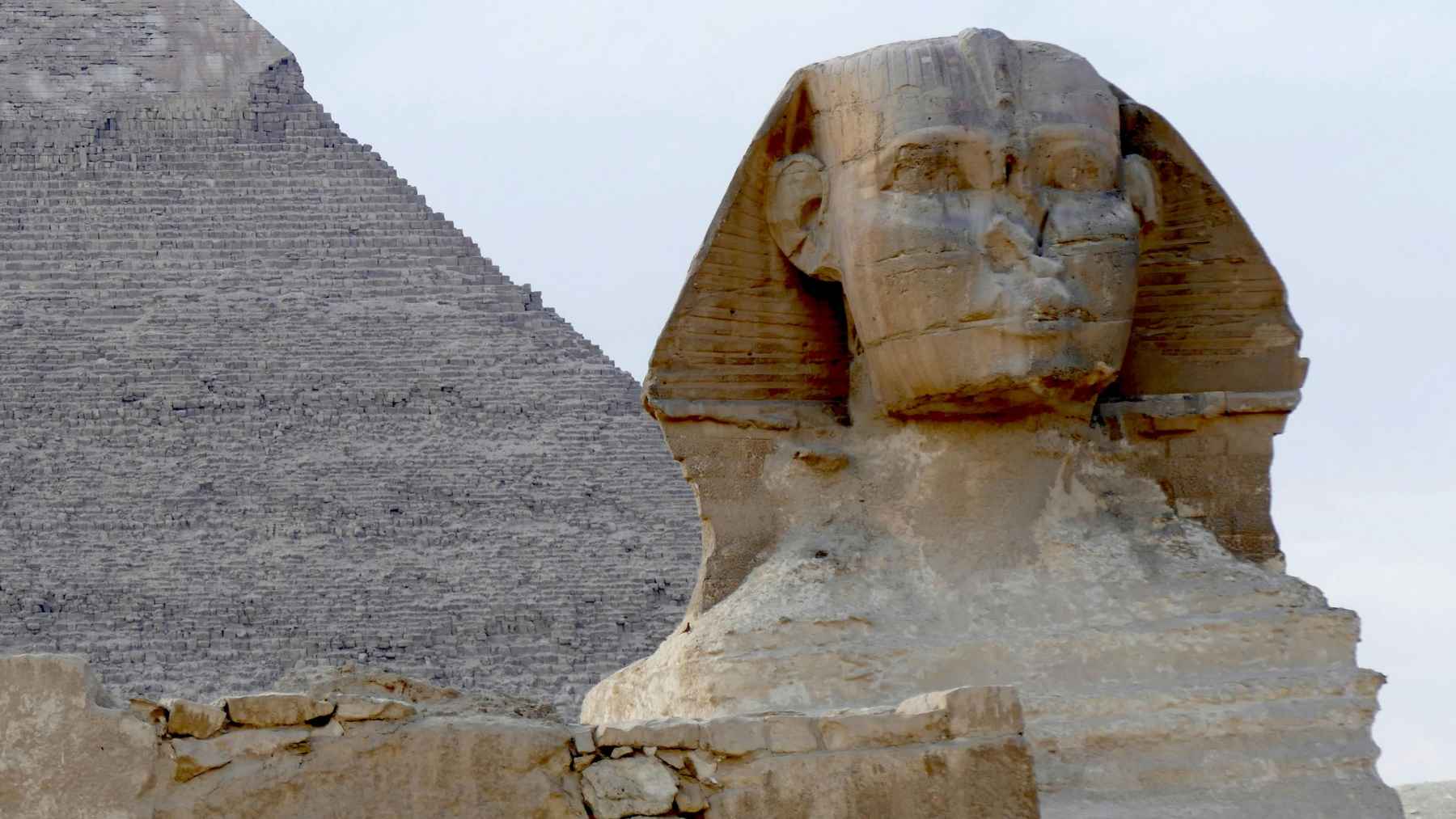 Great Sphinx of Giza on the Giza Plateau with surrounding desert landscape in Egypt