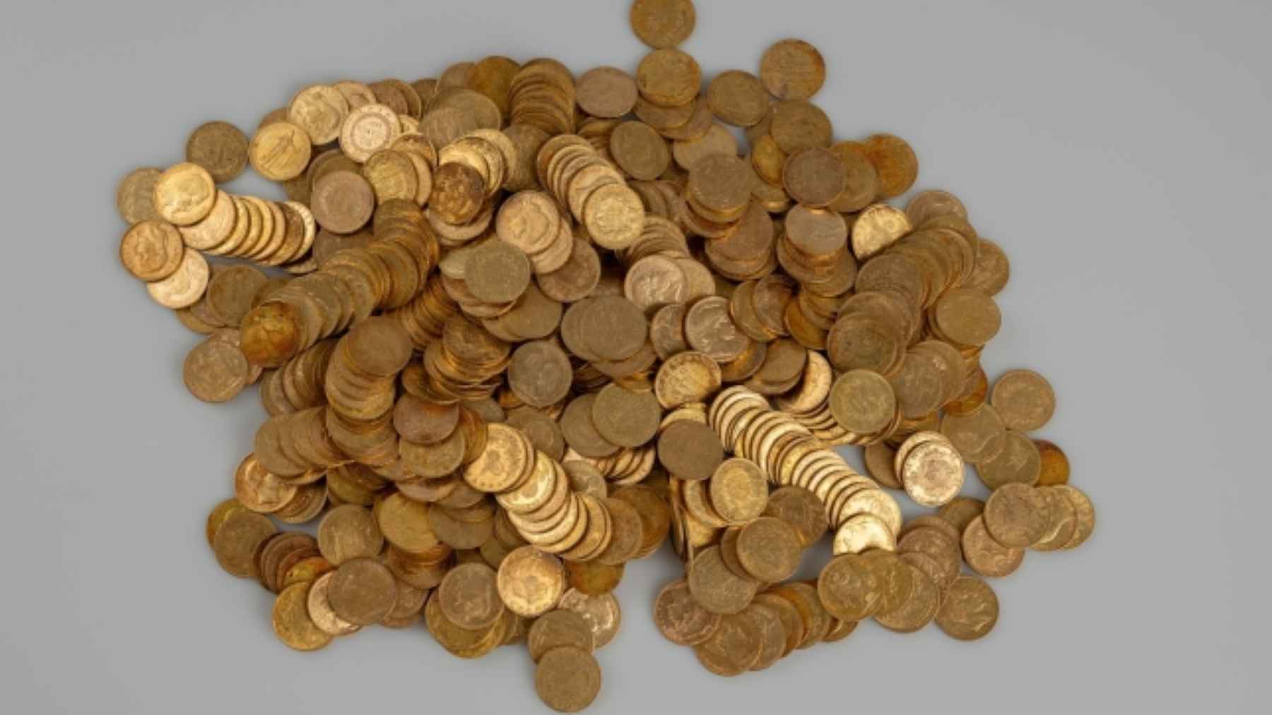 Gold coins and jewelry discovered inside an aluminum container hidden in a stone wall in the Czech Republic