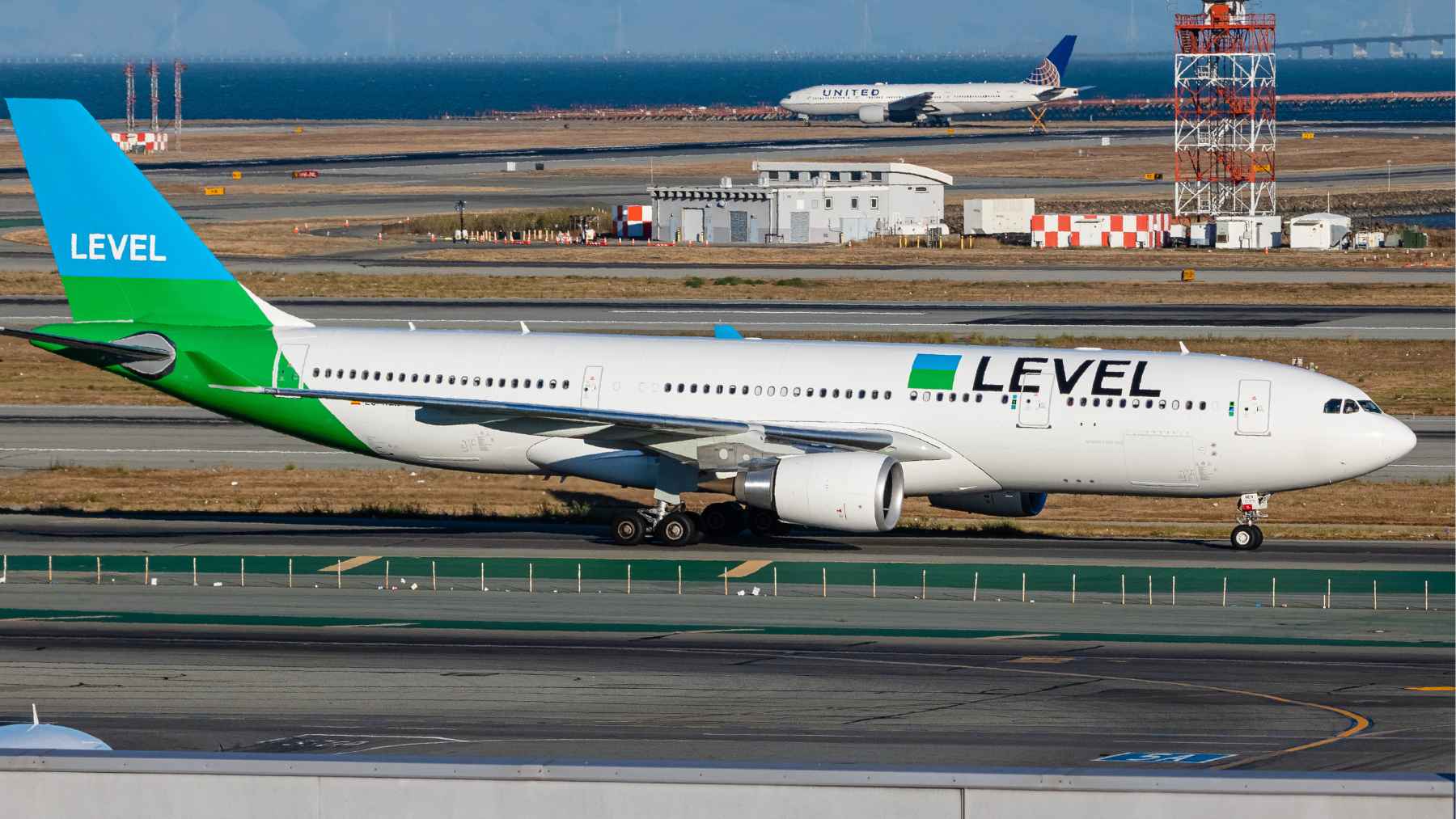 LEVEL Airbus A330 taxiing at San Francisco airport as airline suspends Barcelona route due to engine shortages