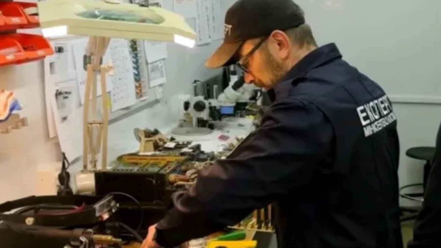 Fragments of a North Korean ballistic missile, including engine parts and internal wiring, being examined by Ukrainian forensic experts.