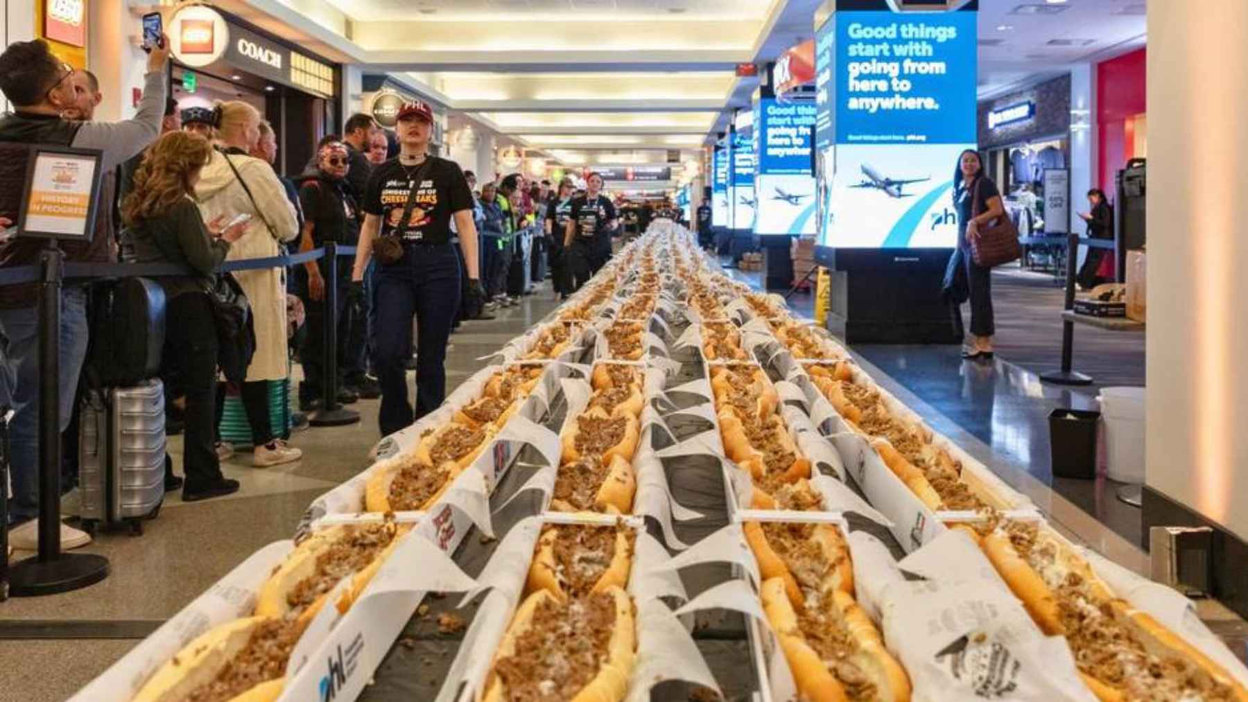 Record-breaking line of cheesesteaks displayed across airport terminal walkway in Philadelphia