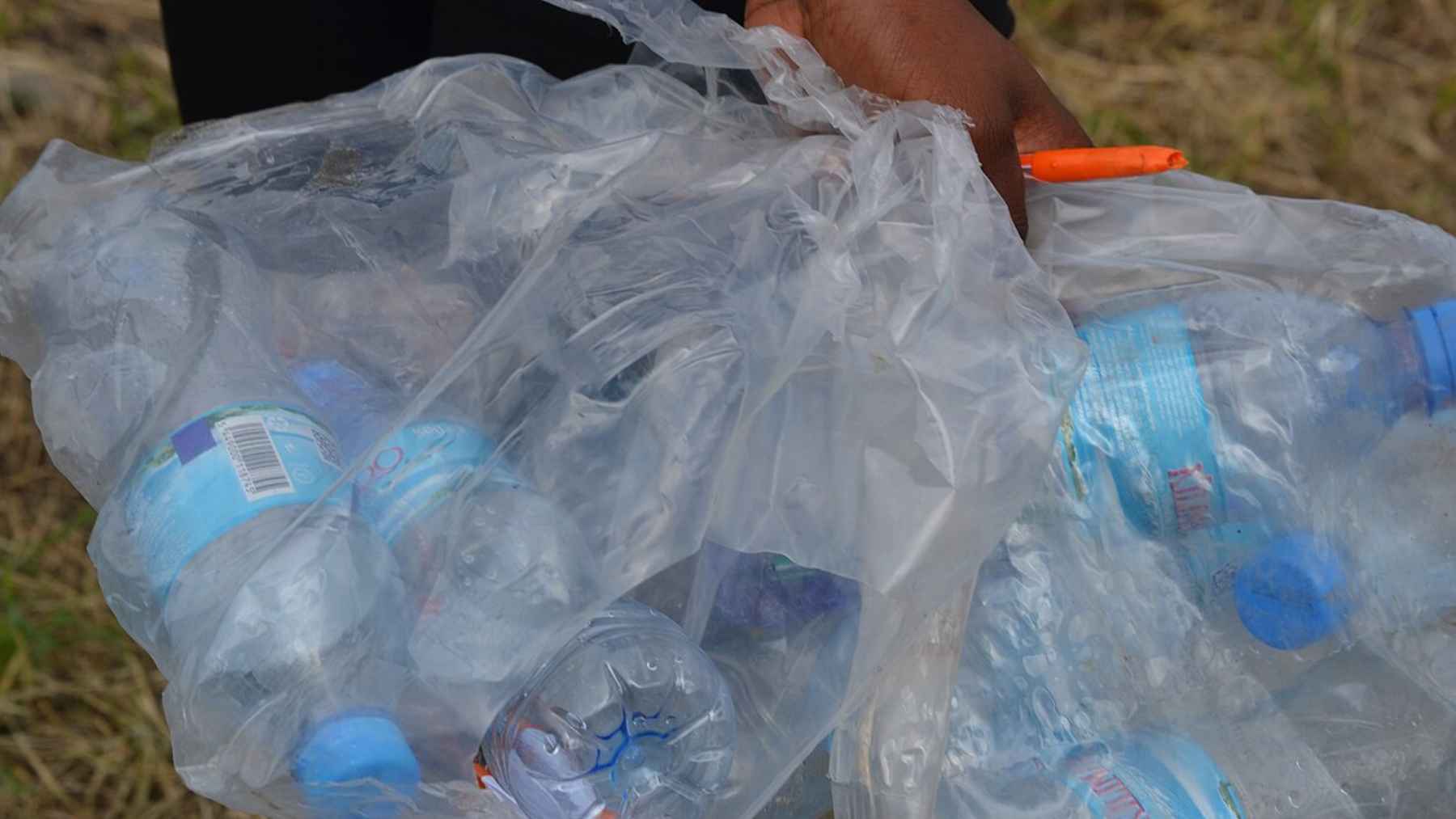 Mixed plastic waste in a recycling bin highlighting limits and inefficiencies in the global recycling system