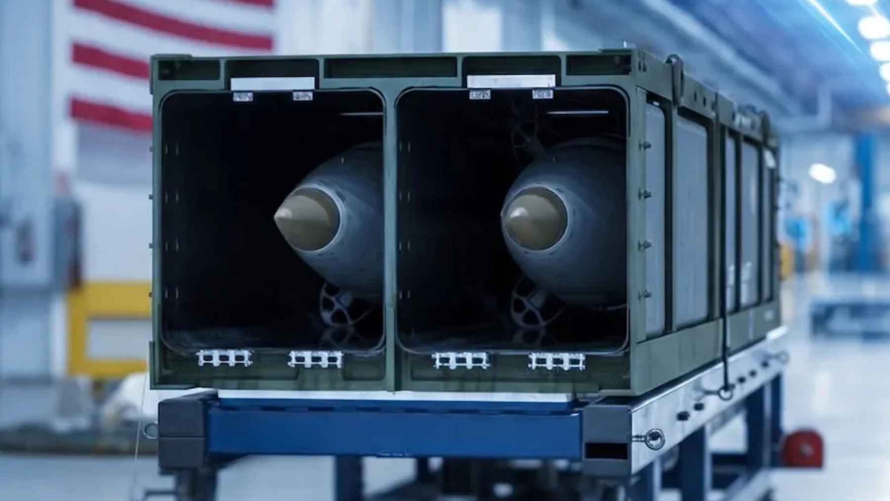 Precision Strike Missile pods inside a containerized launcher system displayed in a U.S. defense production facility
