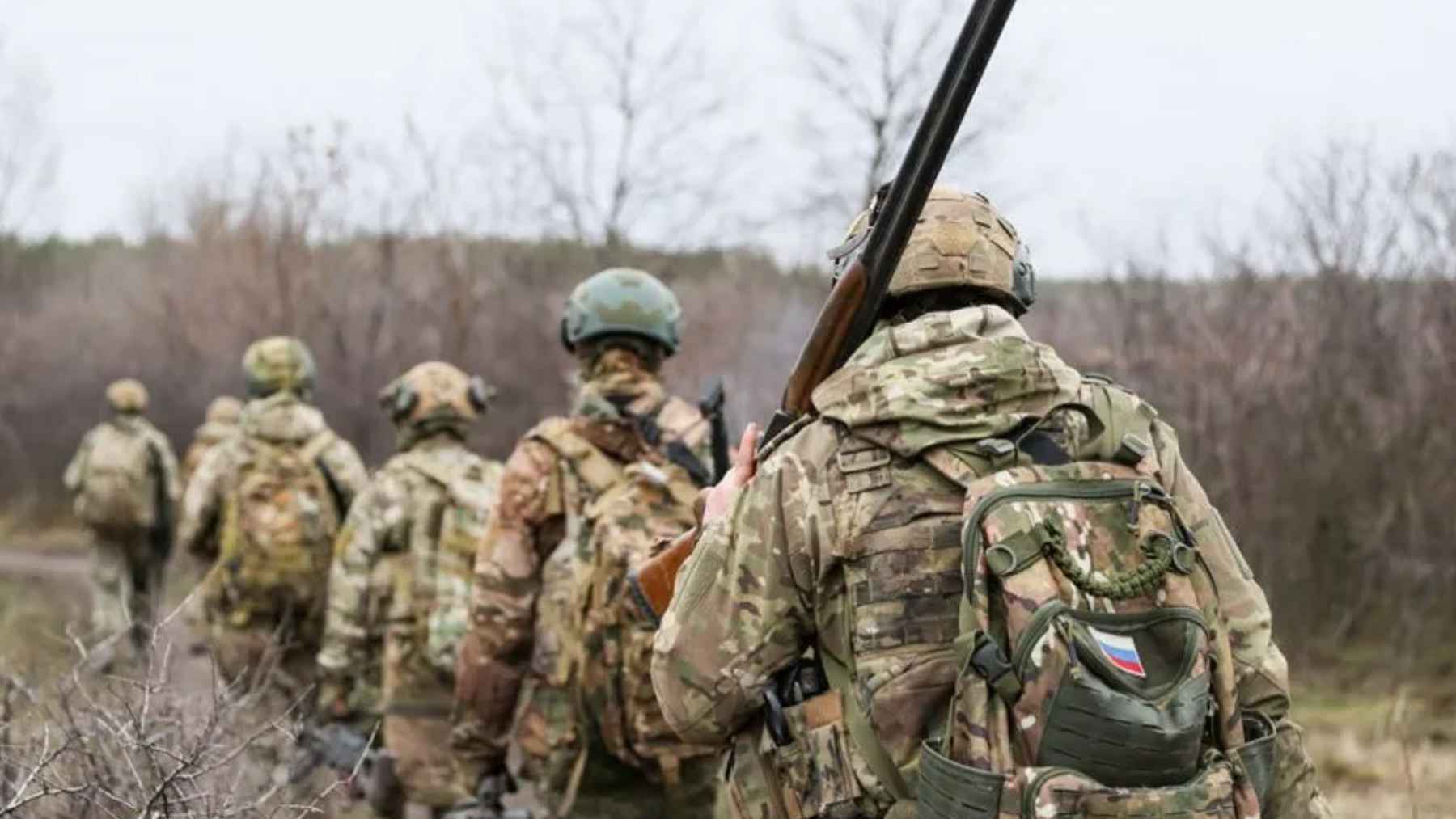 A factory floor in Russia where workers are operating industrial machinery under new military recruitment candidate quotas.