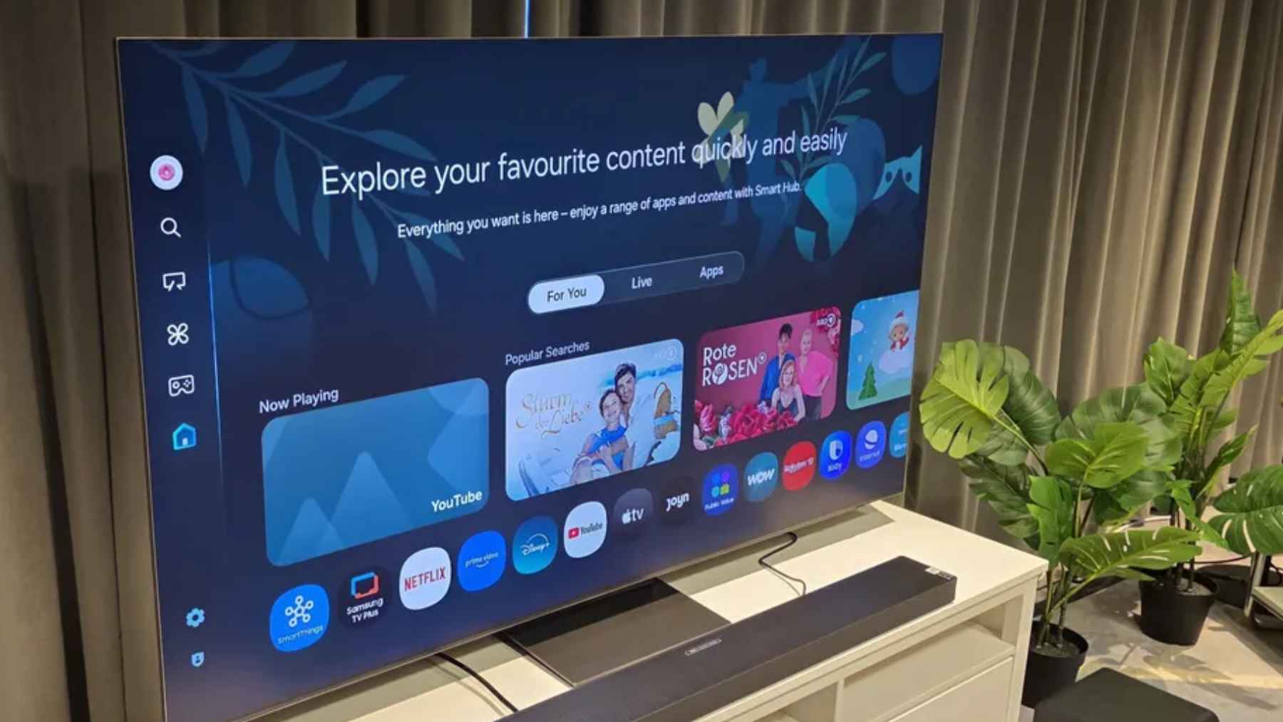 Samsung smart TV showing a home screen with streaming apps, illustrating concerns over ACR tracking and user data consent