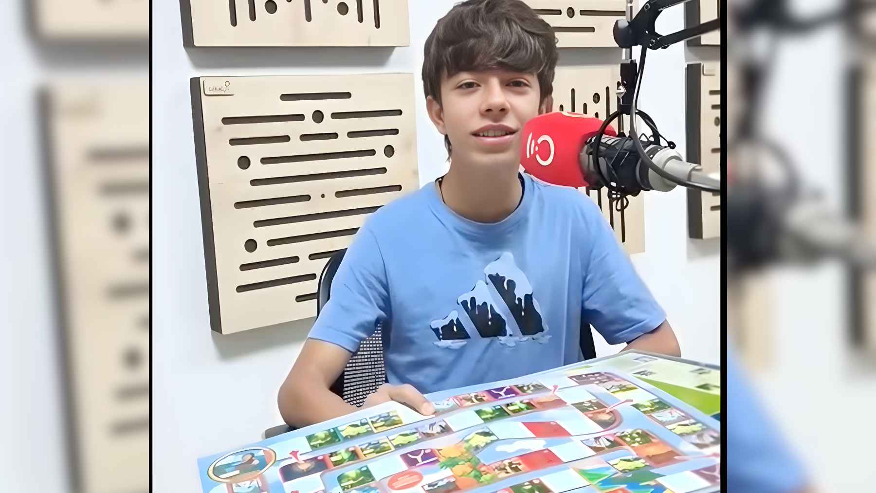 Teenager from Colombia presenting a bird conservation board game designed to teach kids about Andean species