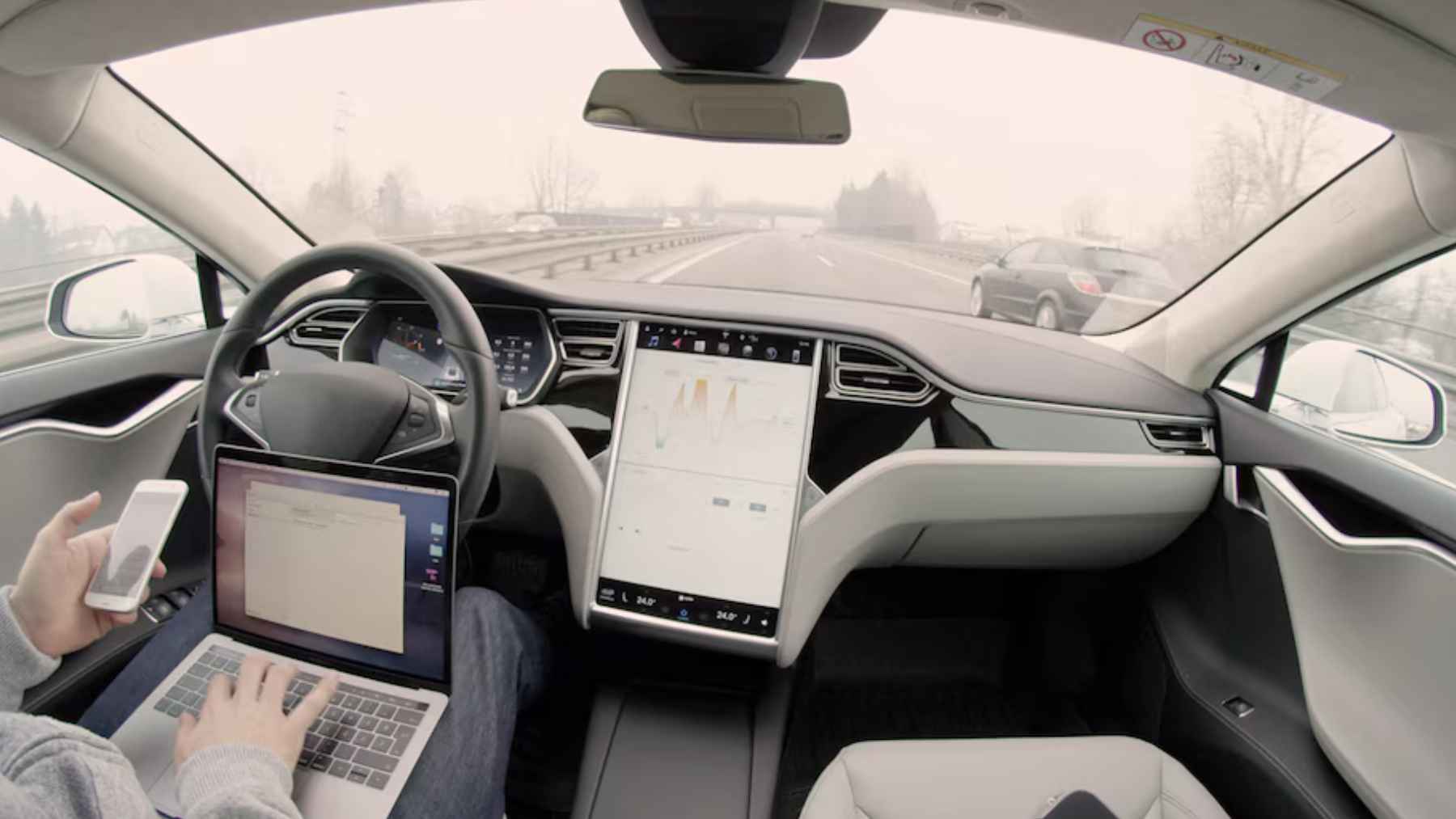 Tesla Model Y driving on a European street using Full Self-Driving supervised system with driver attention monitoring