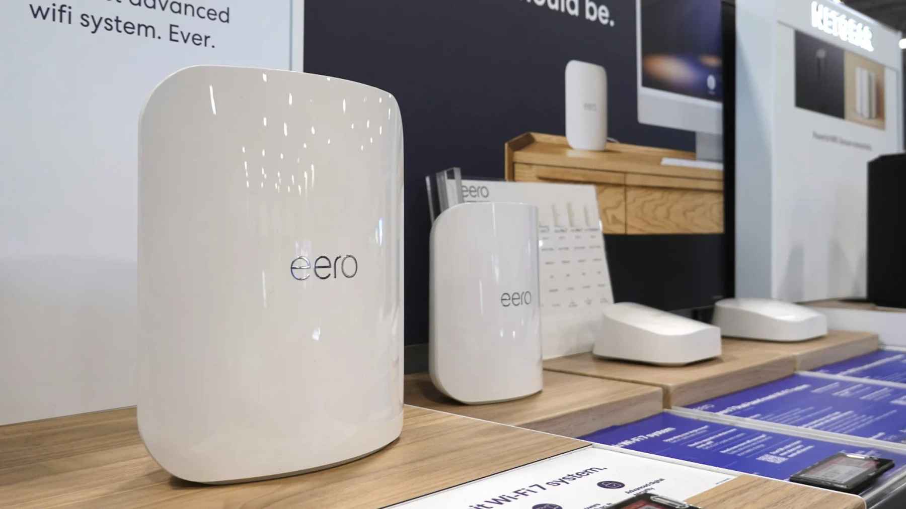 Eero Wi-Fi routers displayed in a retail setting, representing consumer home networking devices affected by FCC policy changes