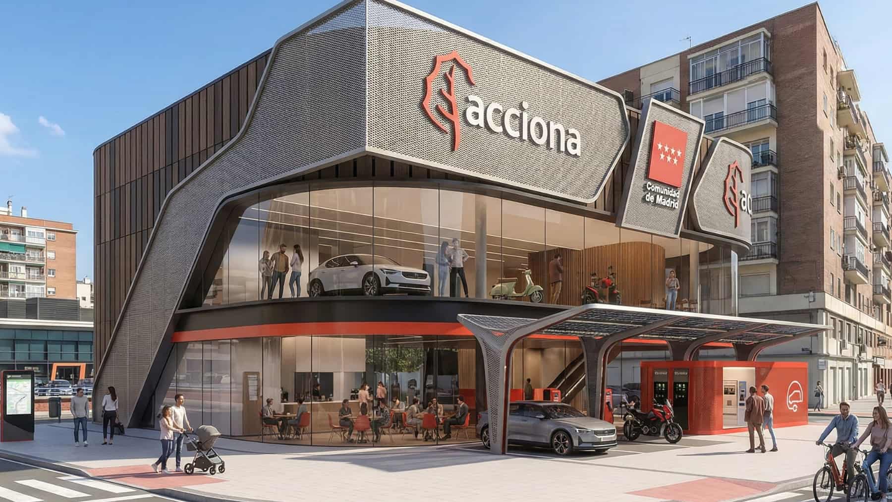 Edificio moderno de Acciona con rótulo de la Comunidad de Madrid, punto de recarga y zona de movilidad sostenible en una esquina urbana